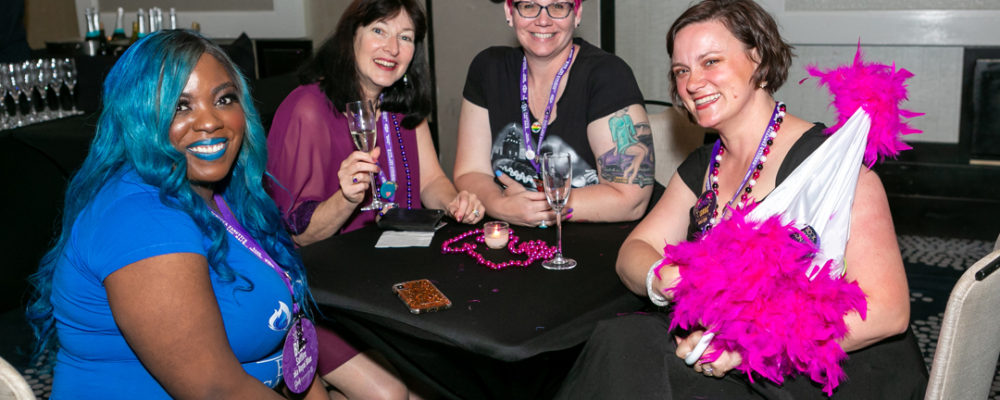 Authors Blue Saffire, Alyssa J Montgomery & Eva Moore sit together at the BLC19 pre-Jazz Fest author mixer