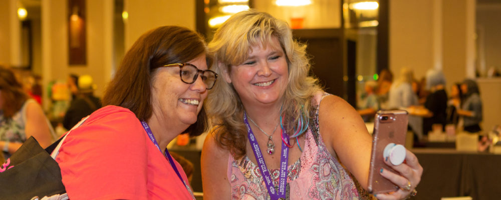 Author Jennie Marts snaps a selfie with a fan